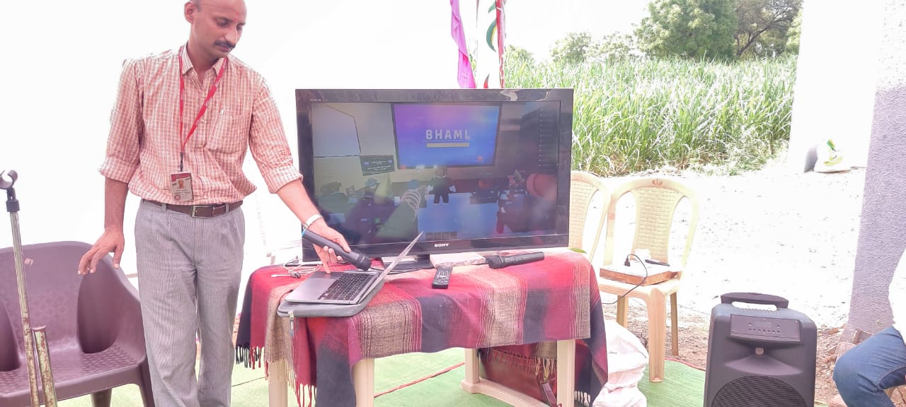 BHAML community demonstration with laptop and screen setup