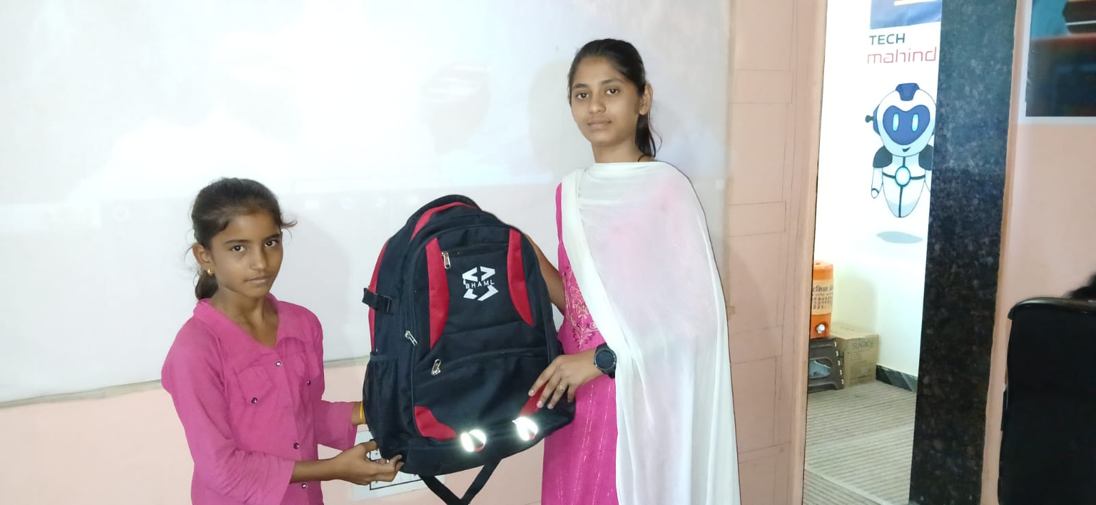 Two students with educational materials and backpack