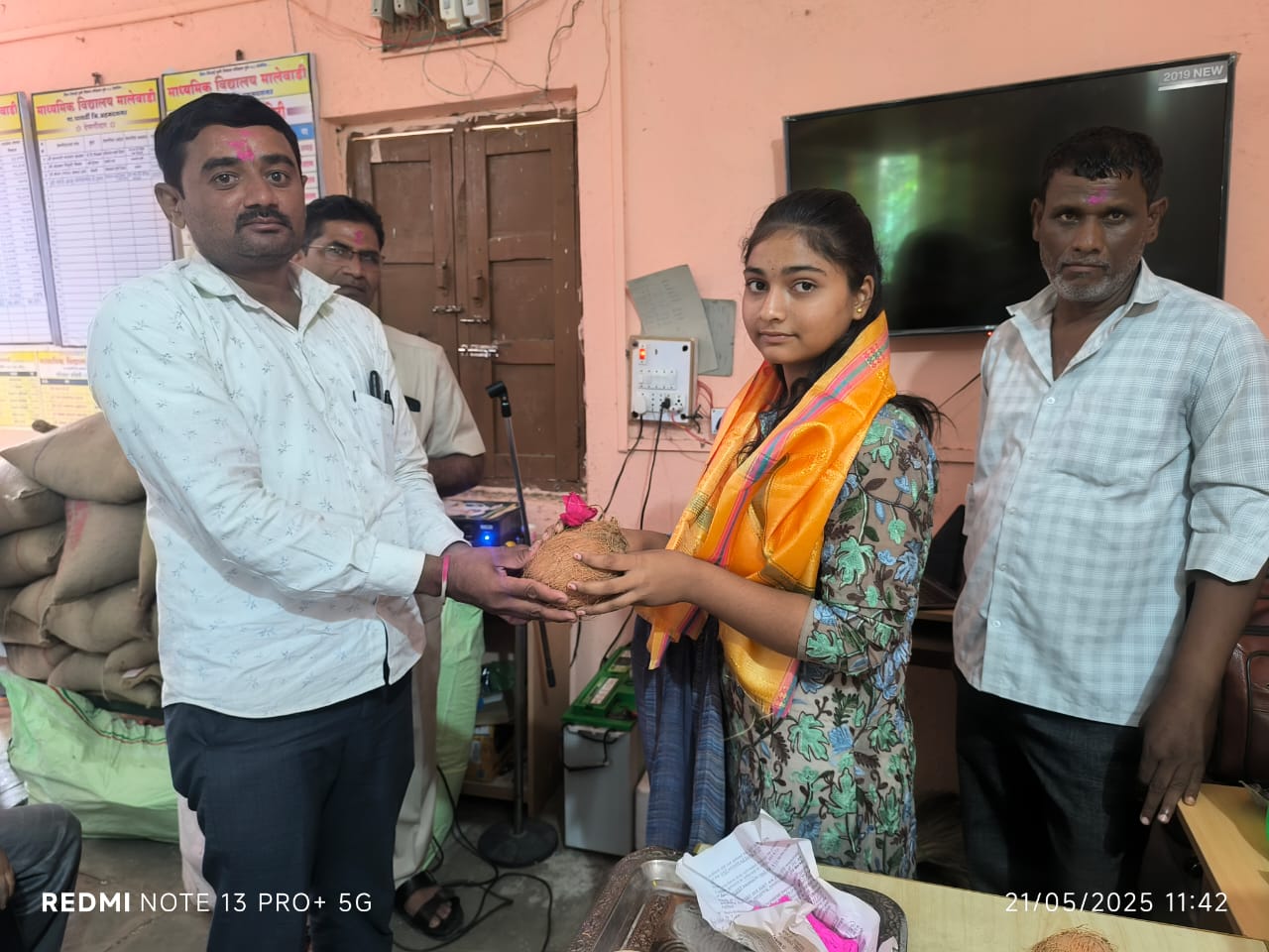 Traditional ceremony with coconut offering to student